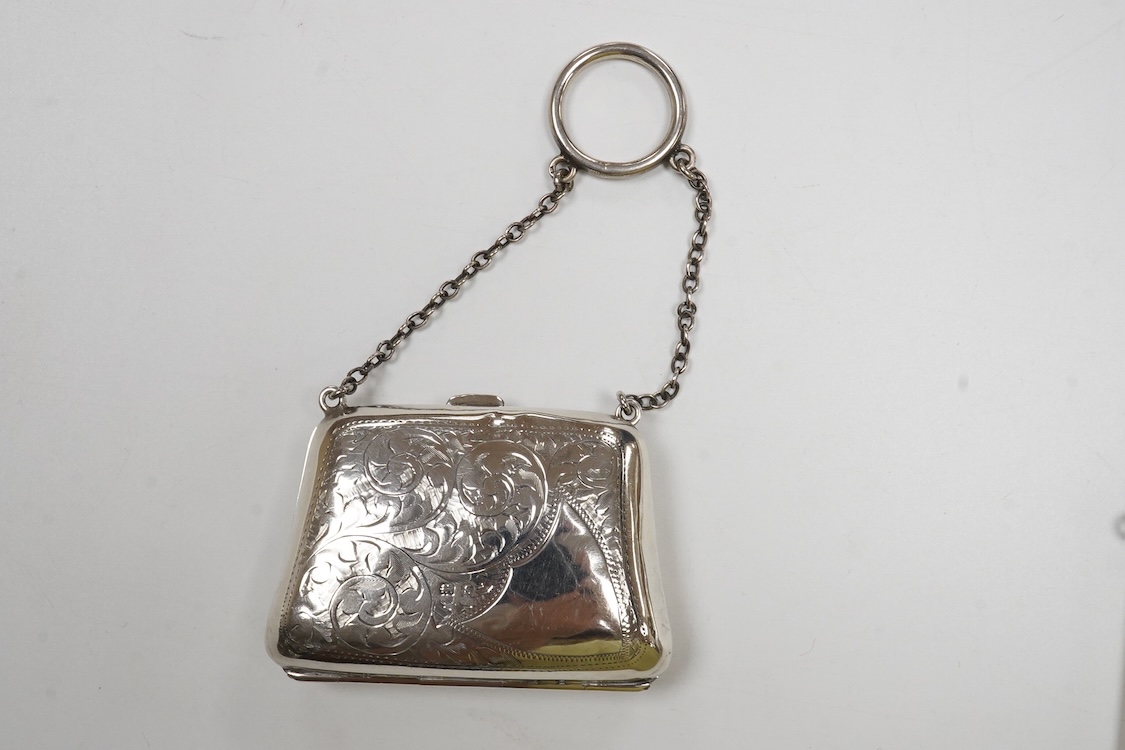 A George V engine turned silver card case, with suspension chain, Synyer & Beddoes, Chester, 1911, 97mm, together with a silver mounted purse, with suspension chain.